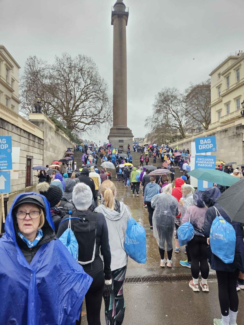 The bag drop queue - drenched and miserable